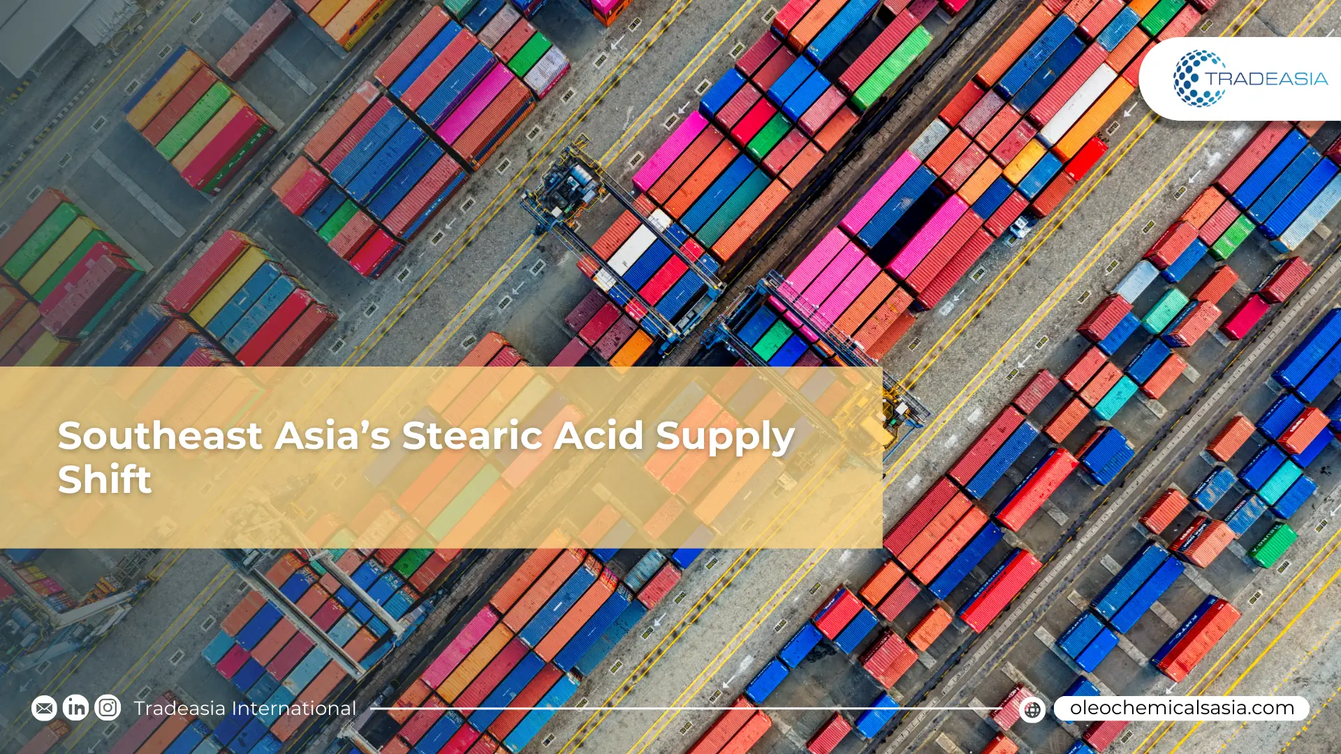 Aerial view of a major Southeast Asian shipping port with chemical storage tanks and container ships